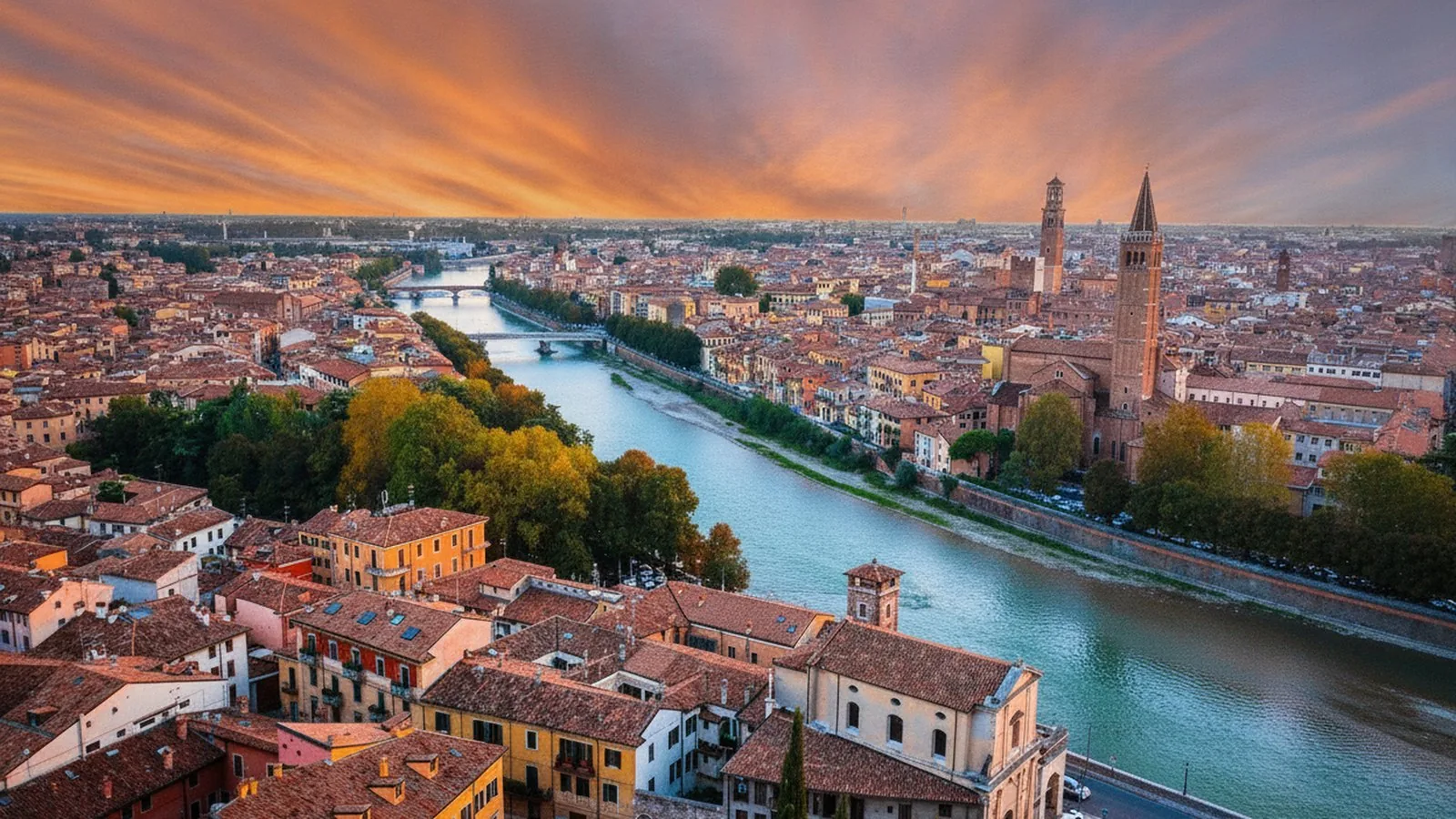 Veduta dall'alto di Verona con l'ansa dell'Adige e i tetti del centro storico al tramonto